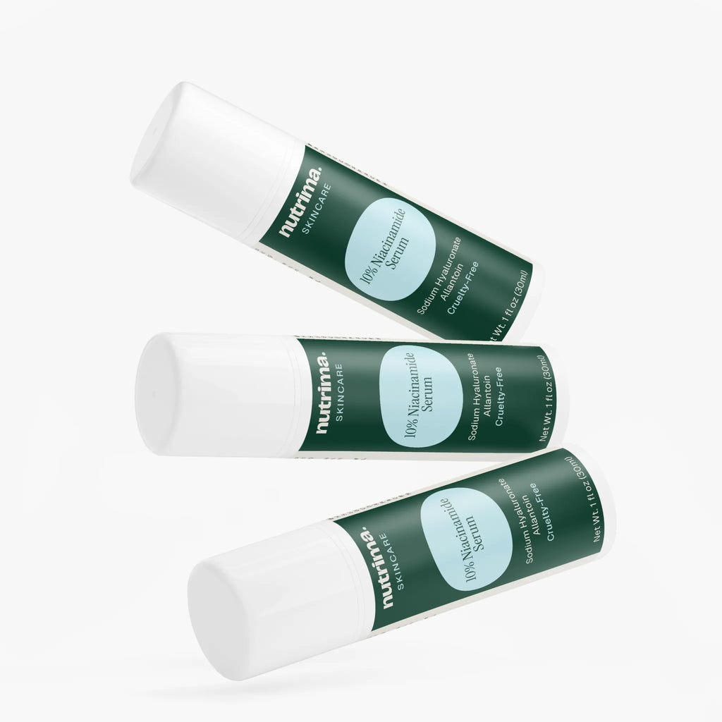 Three bottles of 10% Niacinamide Serum by nutrima, showcasing a sleek design with green labels against a white background.