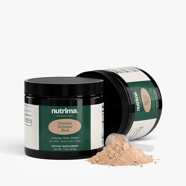 Fermented Mushroom Blend by nutrima in a sleek black jar with powder spilled beside it.