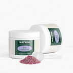 Reds Superfood powder in a jar with a scoop and spilled powder, showcasing its pink color and packaging by nutrima.