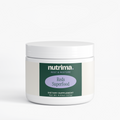 Reds Superfood dietary supplement in a white jar with a green and purple label, by nutrima.