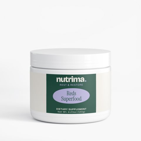 Reds Superfood dietary supplement in a white jar with a green and purple label, by nutrima.