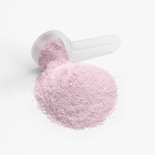 Pink hydration powder sits in a scoop, showcasing its fine texture and color for Intra-Workout Supplements by nutrima.