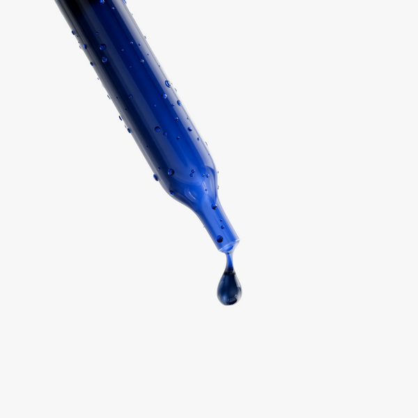 A close-up of a blue dropper with a droplet of Methylene Blue, showcasing its liquid texture by nutrima.