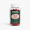 Clear bottle of Hair, Skin & Nails Gummies featuring vibrant red gummies, labeled by nutrima as a dietary supplement.