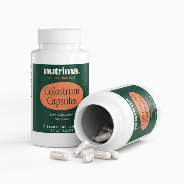 Colostrum Capsules bottle prominently displayed, with capsules spilling out, by nutrima.