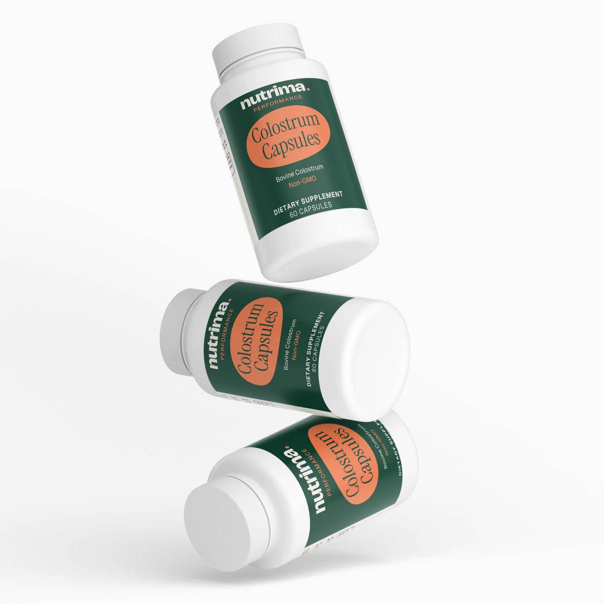 Three bottles of Colostrum Capsules showcasing the distinctive green label and white caps, by nutrima.