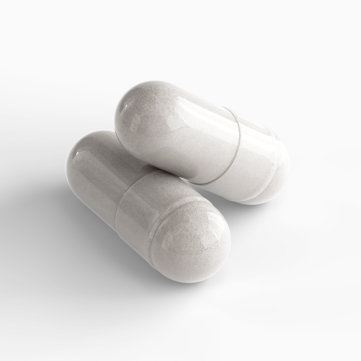 Two shiny white Colostrum Capsules lying close together on a smooth surface, showcasing the product's unique design by nutrim