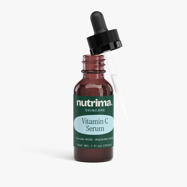 Amber glass bottle of Vitamin C Serum with dropper, highlighting the product name and brand, by nutrima.