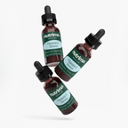 Three bottles of Vitamin C Serum showcasing the dark glass design and unique label by nutrima.
