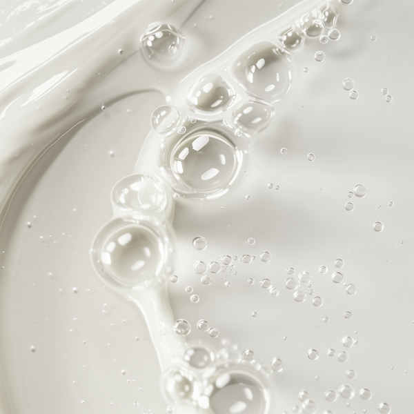 Close-up of airy bubbles in a creamy fluid texture, representing Gentle Balancing Toner (Facial Care) by nutrima.