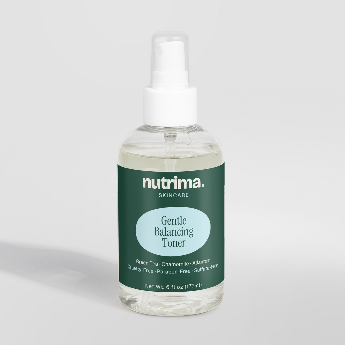 Clear bottle of Gentle Balancing Toner showcasing a green label and spray top, highlighting its calming ingredients by nutrim