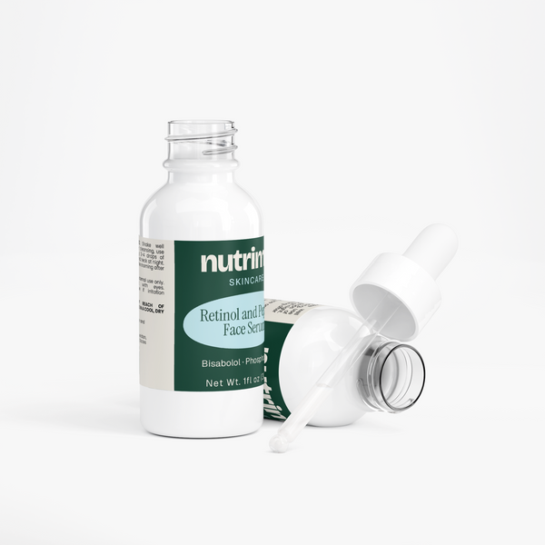 White bottle of Retinol and Peptide Face Serum with dropper cap, showcasing its sleek design by nutrima.