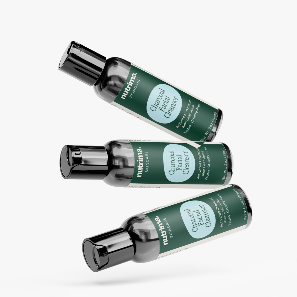 Three bottles of Charcoal Facial Cleanser, featuring a sleek design in dark green, by nutrima.