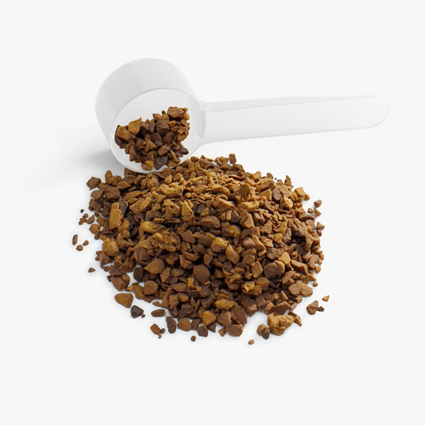 Granules of Sweet Brew Instant Coffee (Dark Roast) with a measuring scoop, showcasing rich, textured coffee blend by nutrima.
