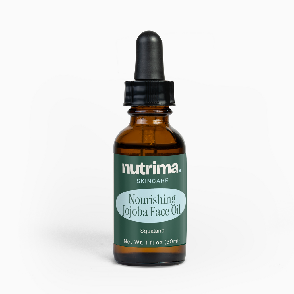 Amber glass bottle of Nourishing Jojoba Face Oil with dropper cap, featuring a teal label by nutrima.