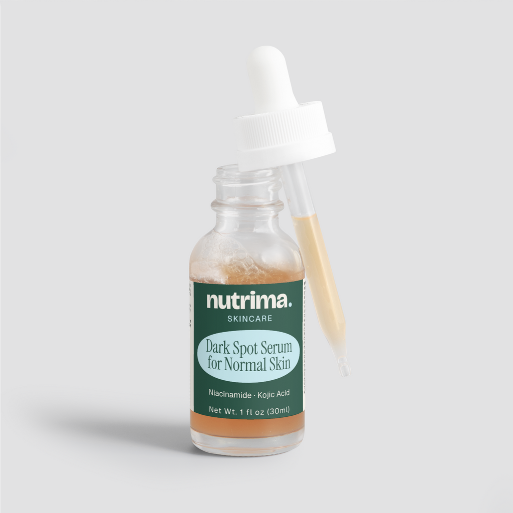 Close-up of the Dark Spot Serum for Normal Skin, highlighting its amber liquid and dropper, packaged by nutrima.