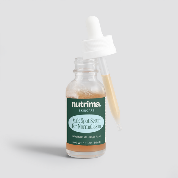 Close-up of the Dark Spot Serum for Normal Skin, highlighting its amber liquid and dropper, packaged by nutrima.
