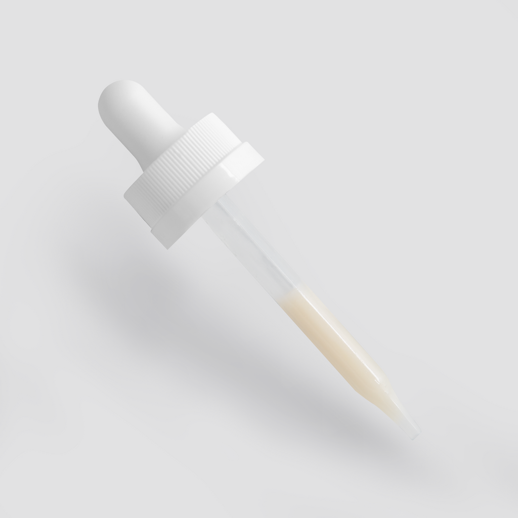 Clear dropper with light beige serum, angled to highlight its functionality in the Dark Spot Serum for Normal Skin by nutrima