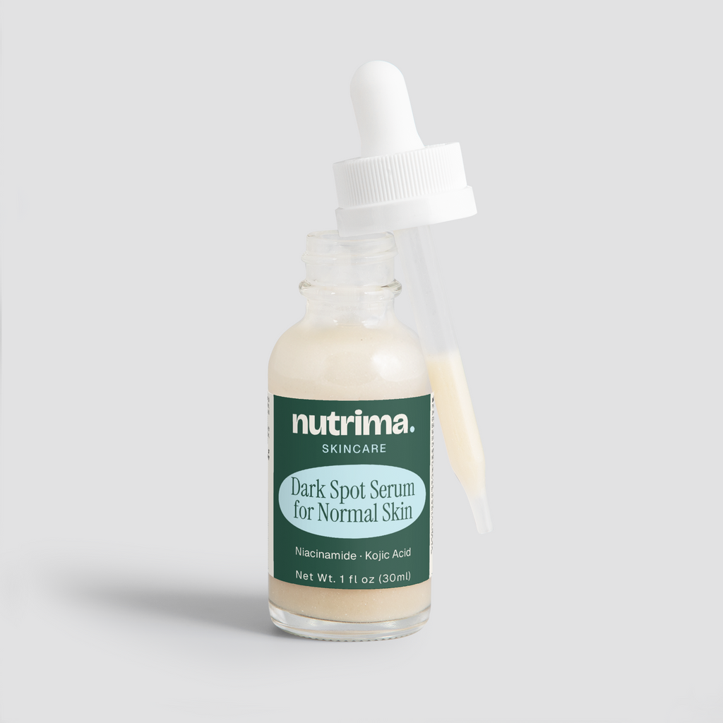 Close-up of the Dark Spot Serum for Normal Skin with dropper, showcasing its creamy texture and packaging by nutrima.