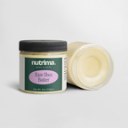 Transparent jar of Raw Shea Butter with a black lid, showcasing its creamy texture, by nutrima.