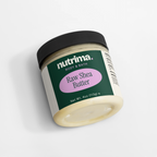 Jar of Raw Shea Butter with a black lid and green label, showcasing its creamy texture, by nutrima.