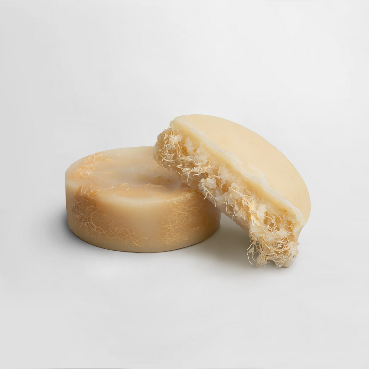 Two Exfoliating Luffa Bars showcasing a textured surface, highlighting their unique exfoliating properties by nutrima.
