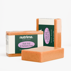 Three bars of Kojic Acid & Turmeric Soap in orange packaging, showcasing the brand nutrima.