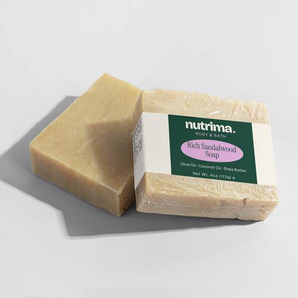 Two bars of Rich Sandalwood Soap featuring a clear label, showcasing a creamy texture and wrapped by nutrima.