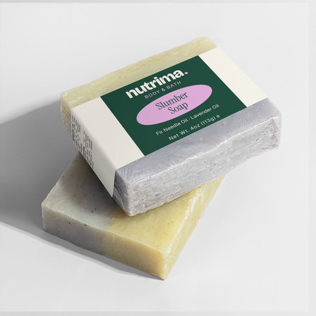 Two bars of Slumber Soap stacked, featuring lavender and fir needle oil, packaged for a soothing bath experience by nutrima.