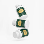 Three bottles of 5-HTP dietary supplement displaying a vibrant green label by nutrima.