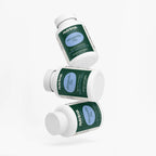 Three bottles of Ashwagandha Plus displayed at an angle, featuring a green label and white caps by nutrima.