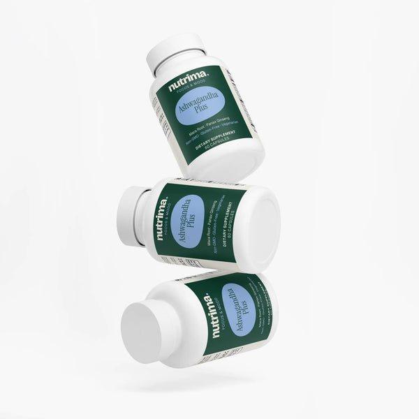 Three bottles of Ashwagandha Plus displayed at an angle, featuring a green label and white caps by nutrima.
