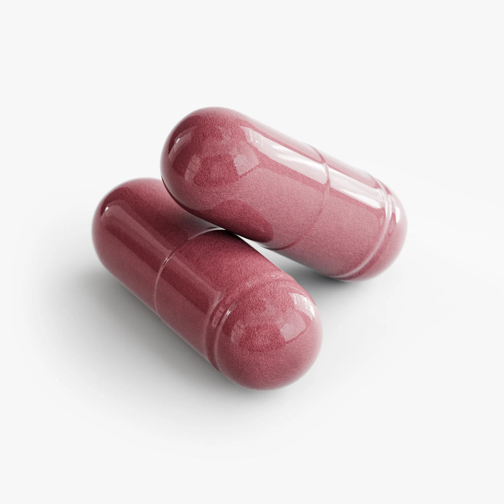 Two glossy, pink Beetroot capsules resting on a white background.