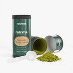 Glistening green Ceremonial Matcha Powder spills from an open canister beside a measuring scoop by nutrima.