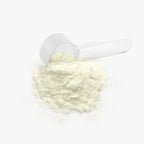 Close-up of Colostrum Powder with a scoop.