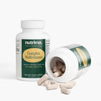 Complete Multivitamin by nutrima shown in an open bottle with capsules spilling out, highlighting its dietary supplement form