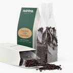 Deep Roast Coffee (Dark Roast) in a clear bag with spilled beans alongside distinctive packaging by nutrima.