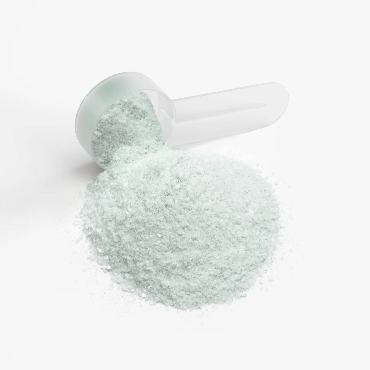 Light green Energy Powder (Melon Creamsicle) with a clear scoop, displayed in a pile on a white background by nutrima.