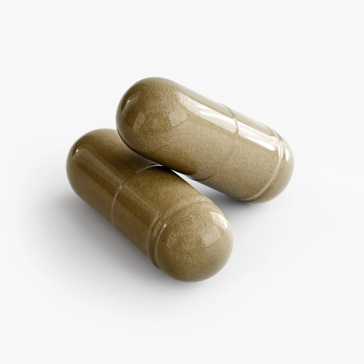 Two glossy brown capsules of Ginkgo Biloba + Ginseng stacked together on a white background by nutrima.