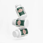 Three floating bottles of Hair, Skin and Nails Essentials by nutrima, showcasing a clean design and bright labels.