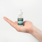 Hyaluronic Acid Serum held in a hand, showcasing its clear bottle and label details by nutrima.