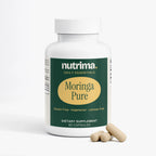 Moringa Pure capsules in a white bottle with green label, shown with three capsules, by nutrima.