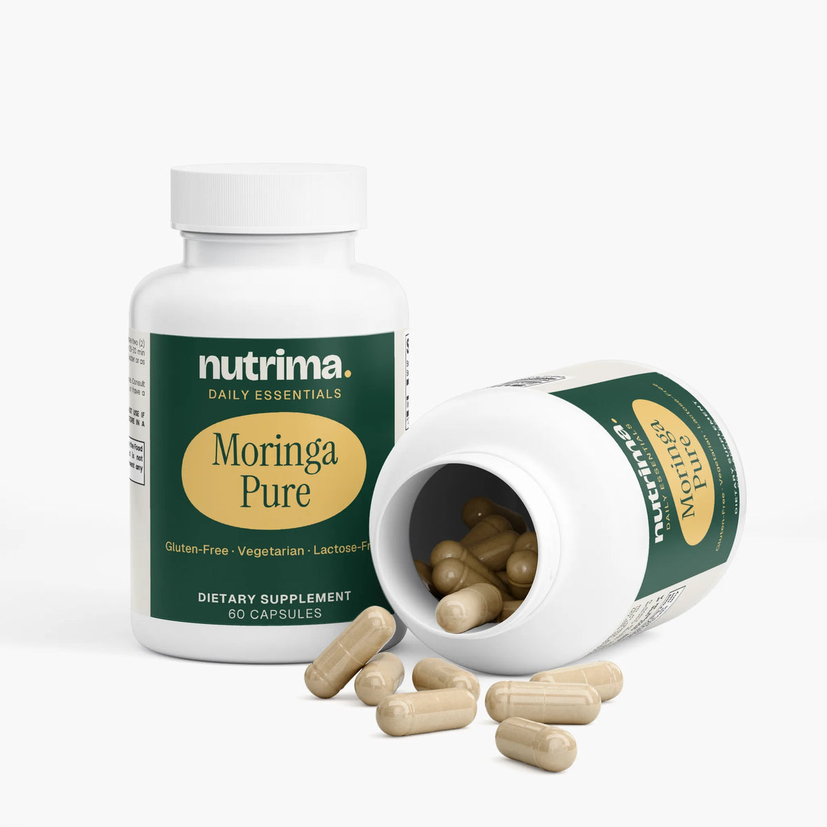 Moringa Pure dietary supplement capsules spilled from an open bottle, featuring a green and yellow label design by nutrima.