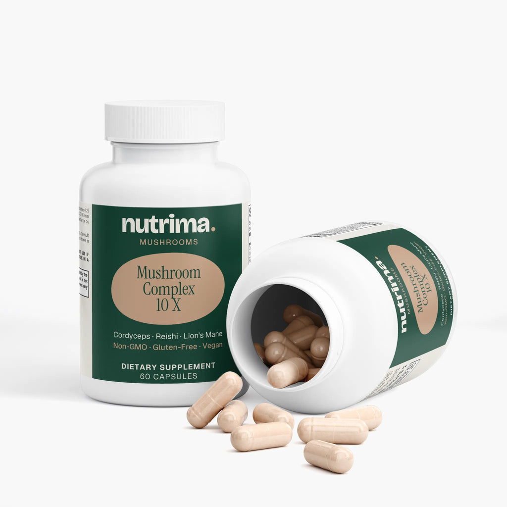 Mushroom Complex 10 X dietary supplement capsules spilled from an open bottle, highlighting their beige color by nutrima.