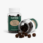 Mushroom Extract Complex gummies in a clear bottle with some gummies scattered outside, by nutrima.