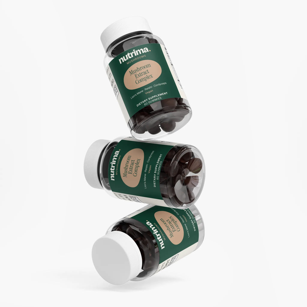 Three bottles of Mushroom Extract Complex by nutrima displayed at an angle, highlighting the green packaging and gummy form.