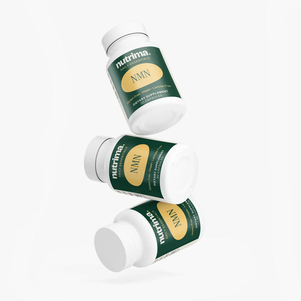 Three bottles of NMN dietary supplement by nutrima with distinctive green and gold labels, showing front and side views.