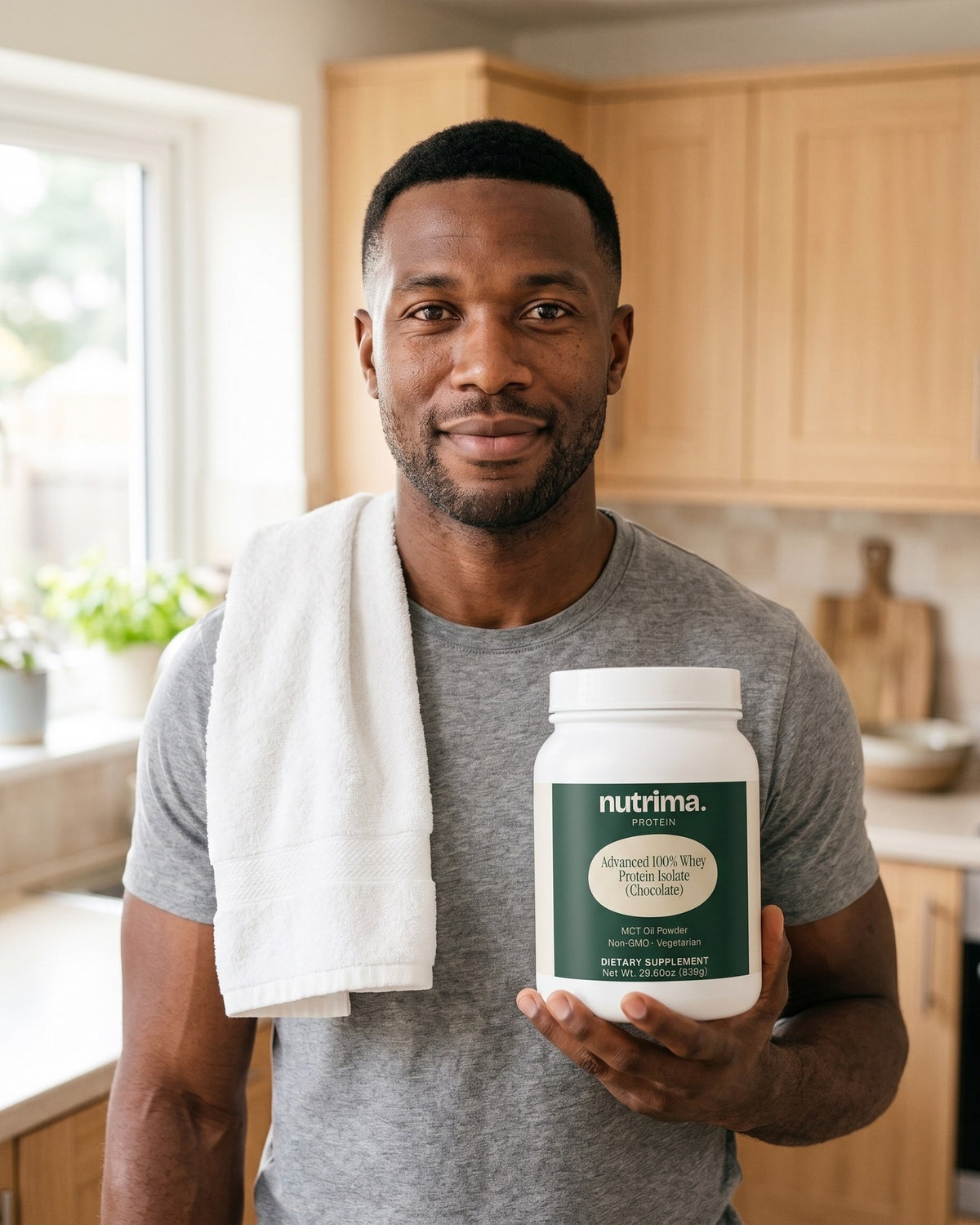 nutrima Advanced 100% Whey Protein Isolate (Chocolate) tub held by a man in a home kitchen — AI-generated brand image
