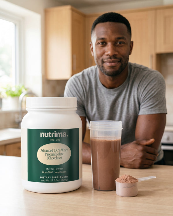 nutrima Advanced 100% Whey Protein Isolate (Chocolate) tub on a kitchen counter beside a shaker of chocolate shake, a man in the background — AI-generated brand image