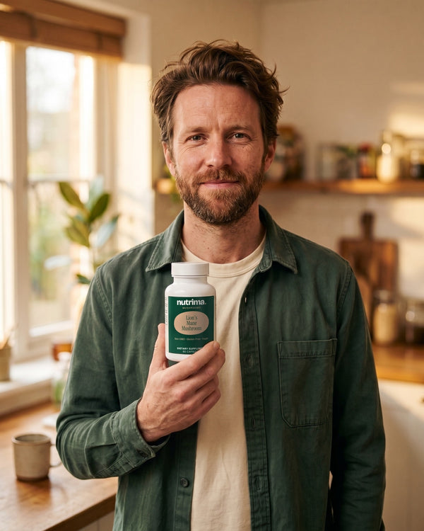 nutrima Lion's Mane Mushroom bottle held by a man at a kitchen counter — AI-generated brand image